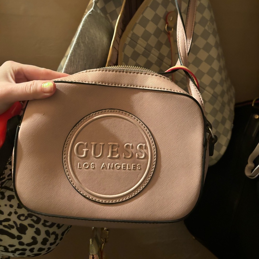 Pale pink guess purse